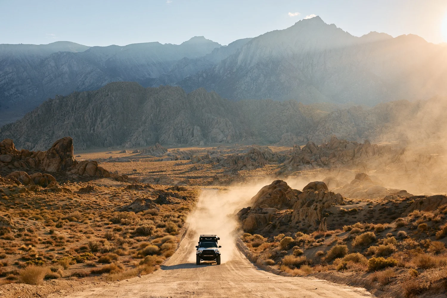 Overlanding rig on a desert road in the Eastern Sierras