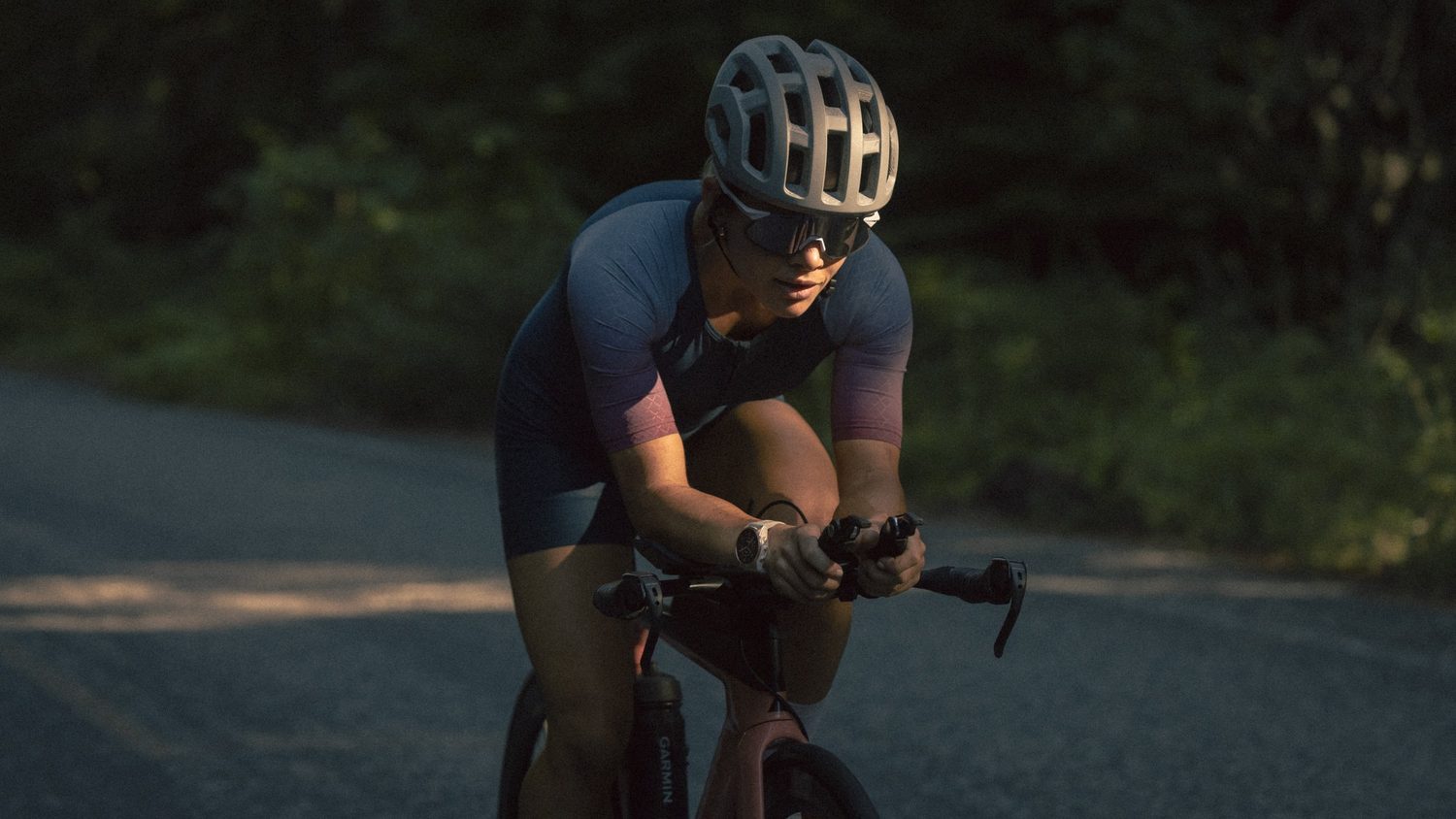 Triathlete on the bike at dusk