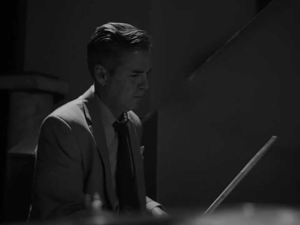 Black-and-white still from the Needlerooser live video